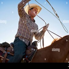 A rancher swinging a looped lasso