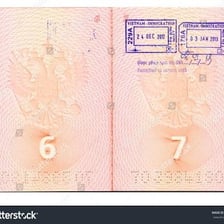 A passport page bearing a visa stamp.