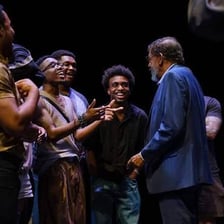An actor performing on a theater stage