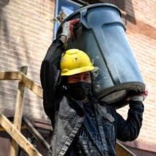 A person performing strenuous manual labor.