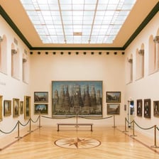 Paintings and sculptures displayed in an art gallery