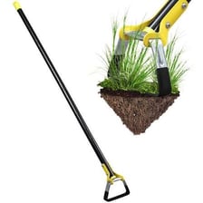 A garden hoe being used to remove weeds