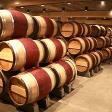 Wine aging in a wooden barrel.