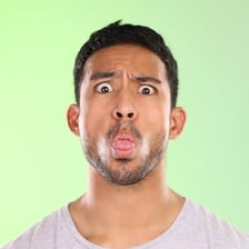A humorous portrait of a person making an awkward expression.