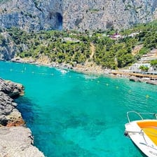 A scenic view of Capri’s rocky coastline and blue sea