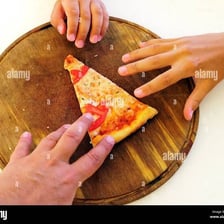 A person eating a slice of pizza.