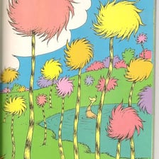 The Lorax standing among trees in an illustration.