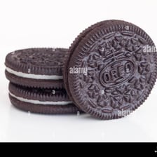 A chocolate sandwich cookie with a white cream center