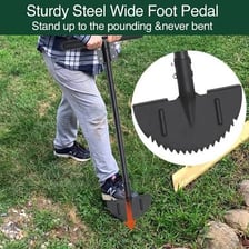 A lawn edger being used to create a clean garden border.