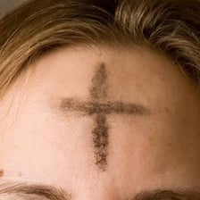 A worshipper receiving ashes on Ash Wednesday