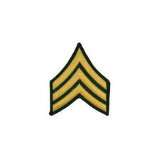 Military insignia identifying the rank of sergeant.