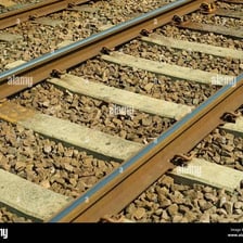 A steel railroad rail forming part of a train track
