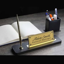 A writer working at a desk, representing the use of a pen name.