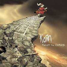 Korn performing or appearing with imagery from the Follow the Leader era