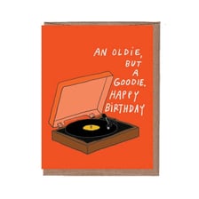 A vintage record player playing an old song