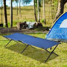 A small folding cot set up for sleeping.