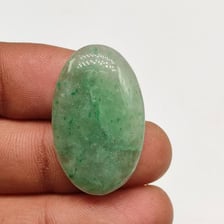 A polished green jade gemstone.