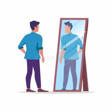 A confident person looking at their reflection in a mirror.