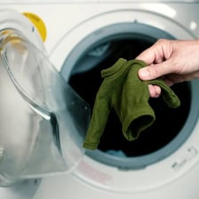 A visibly shrunken sweater after being washed and dried.