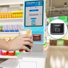 Handheld scanner reading a barcode on a product