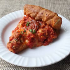 A slice of Chicago-style deep-dish pizza