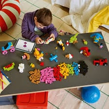 Colorful LEGO building blocks arranged as a construction set.