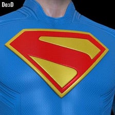 A close-up of Superman’s stylized S emblem