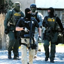 Drug Enforcement Administration agents in an enforcement setting.