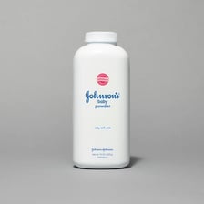 White talc mineral powder beside a sample mineral