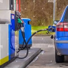 A car being refueled at a gas station.