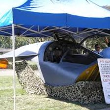 A compact one-person escape pod separates from a larger spacecraft.