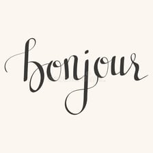 The French phrase “mon ami” written in a simple language-learning context.