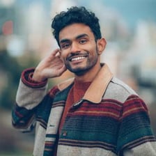 A person holding a pose for a camera.