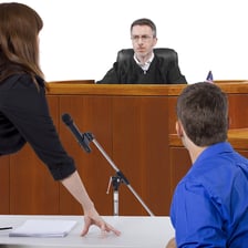 A lawyer addressing a judge in a courtroom