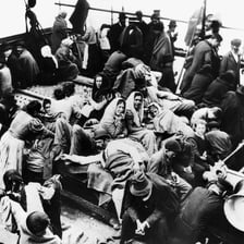 A group of people gathered in a noisy commotion.