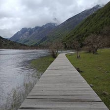 A clear path leading through a mountain landscape