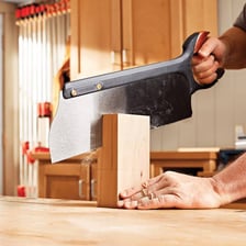 A hand saw with a toothed cutting blade