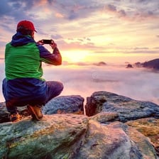 A person showing amazement while viewing an impressive scene.