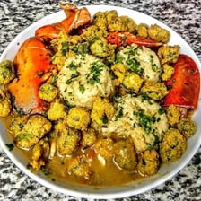 Fried okra beside a bowl of gumbo