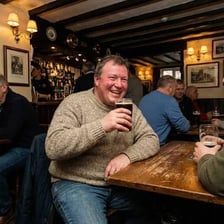 A pint of ale on a pub counter