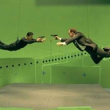 Promotional still from the 1999 film The Matrix showing its signature action style.