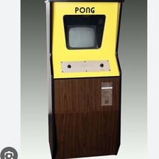 A classic Atari arcade cabinet displaying Pong