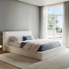 A neatly made bed in a bedroom.