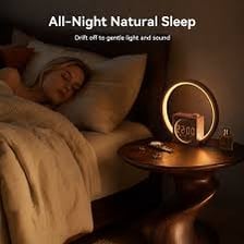 An alarm clock beside a bed in the morning.