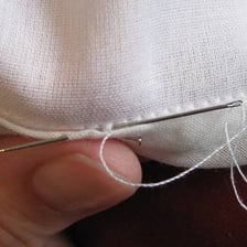 A close-up of a neatly sewn skirt hem.