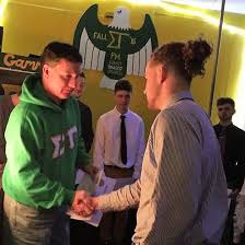College fraternity members greeting one another