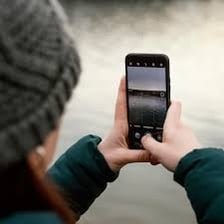 A person taking a quick photo with a smartphone