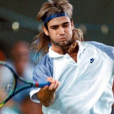 Andre Agassi playing tennis on a court