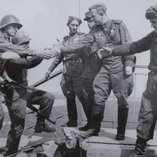 Soldiers from allied nations standing together.