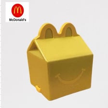 A small toy displayed with a McDonald’s Happy Meal.
